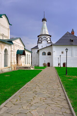 Fototapeta na wymiar The male Spaso-Evfimiev Monastery. The path to the Assumption Refectory Church, a monument of Russian architecture of the XVI century. Suzdal, Russia, 2022