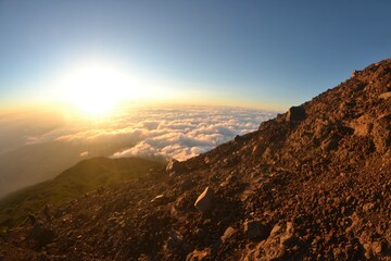 The top view of slamet mountain summit with clear sky and warm light
