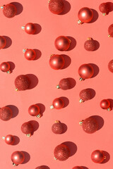 Christmas ornament background in vibrant bold red color. Monochrome red bauble wallpaper.