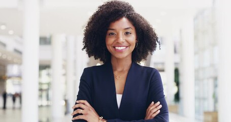 Young, confident and professional business woman laughing while standing in the office with her arms crossed. Portrait of a beautiful, young and happy female looking positive and smiling at work - Powered by Adobe