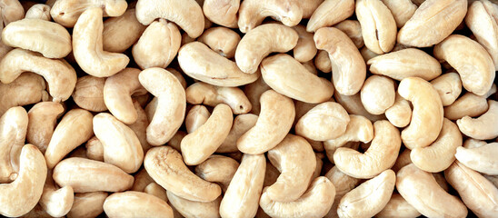 Mix of cashew nut kernels, close-up, top view, macro.