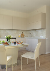 modern kitchen interior, kitchen with a dining table in the living room, modern living room with open plan	