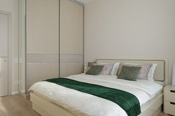 interior of a bedroom, modern bedroom in beige tones
