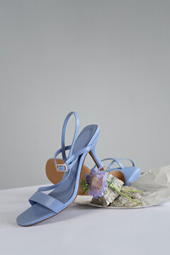 concept image of a pair of summer blue sandals. copy space for text