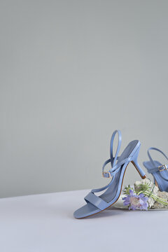 concept image of a pair of summer blue sandals. copy space for text