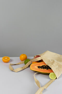 image of fresh fruits inside reusable bag. space for text