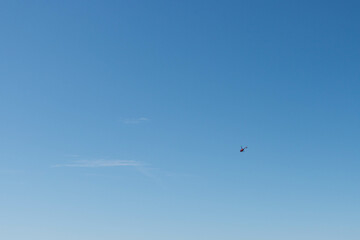 Fototapeta premium beautiful blue sky background with a small helicopter personal there is a place for an inscription