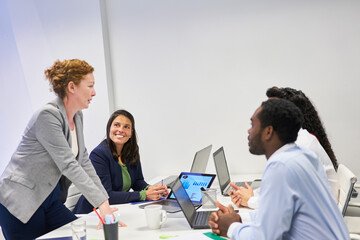 Business woman as a consultant with an international team