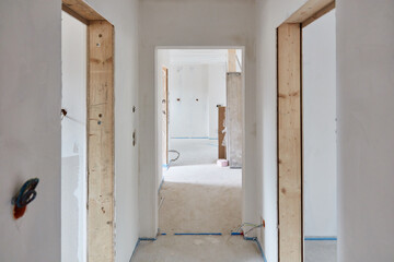 Narrow corridor as a hallway and construction site in a new building