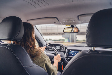 Woman driving a car in city