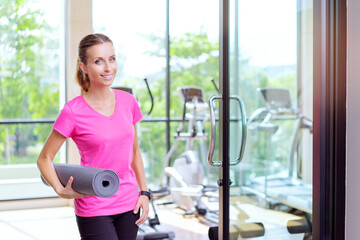 woman holding mat