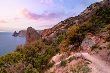 Rocks and waves at coastline picturesque landscape.
