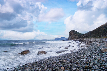 Fototapeta na wymiar Beautiful landscape with rock sea beach and cloudy sky.