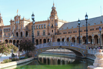 Obraz premium Seville, Spain, September 11, 2021: The Spanish Steps in Seville or 'Plaza de España', where the main building of the Ibero-American Exhibition of 1929 was built. The square of Plaza de Espana.