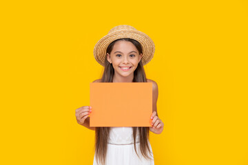 positive teen child with copy space on orange paper on yellow background