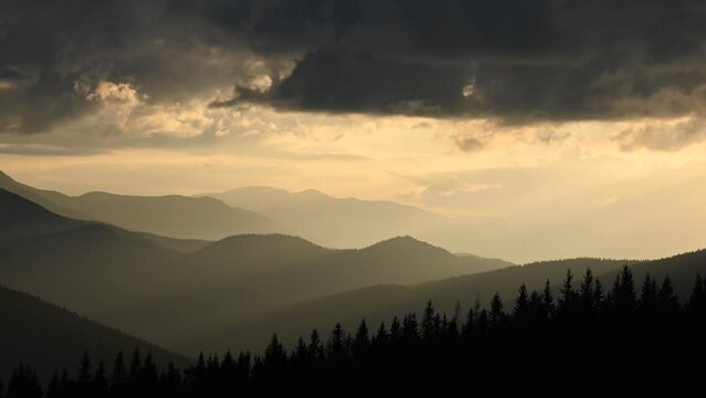 Morning light in spring mountains. Beautiful sunrise on background. UHD 4k timelapse video