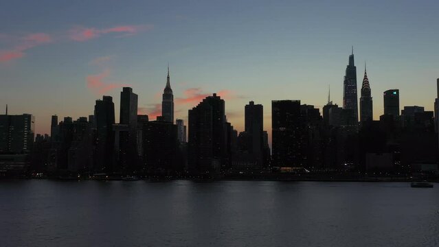 low altitude fast trucking aerial shot of the legendary Midtown Manhattan skyline.  Nice parallax with the tall buildings