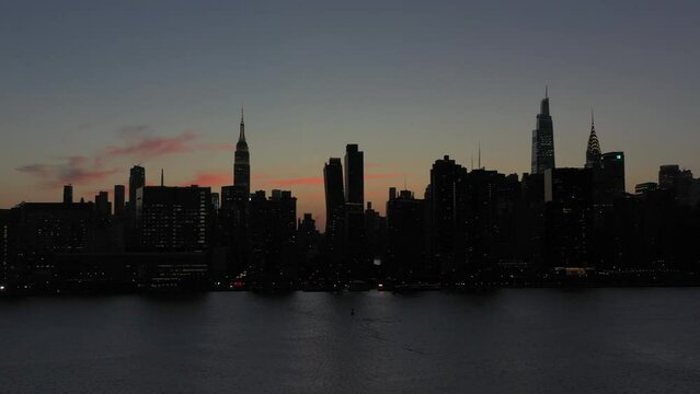 aerial rotation towards the Midtown Manhattan skyline at sunset