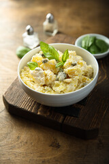 Traditional homemade potato salad with gherkins	