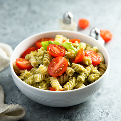 Pasta with pesto sauce and cherry tomatoes