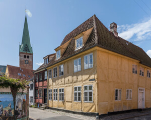 yellow traditional wattle house on crossroads, Helsingor, Denmark