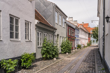 cobbled lane with traditional picturesque colorful houses, Helsingor, Denmark