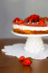 Homemade holiday strawberry 
cake with cottage cheese creamst and strawberry confit decorated with fresh berries