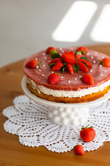 Homemade holiday strawberry 
cake with cottage cheese creamst and strawberry confit decorated with fresh berries