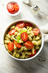 Pasta with pesto sauce and cherry tomatoes