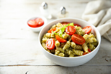 Pasta with pesto sauce and cherry tomatoes