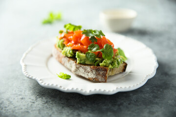 Fototapeta na wymiar Healthy avocado toast with salmon