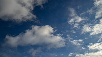 Fototapeta na wymiar Beautiful nature background. Blue sky with white clouds.