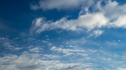 Naklejka na ściany i meble Beautiful nature background. Blue sky with white clouds.