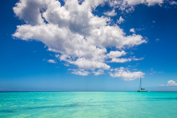 Obraz premium Tropical paradise: idyllic beach with sailboat, Punta Cana, Dominican Republic