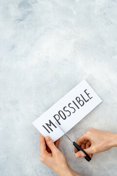 Paper card Impossible change into Possible with scissors
