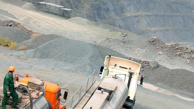 Heavy equipment in the quarry. Equipment for blasting soil in an iron ore quarry. Equipment for explosives in the quarry.