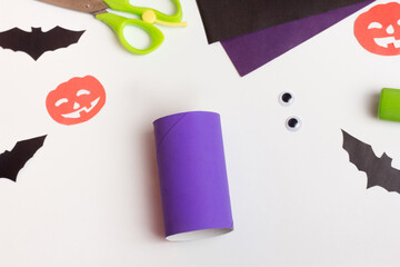 Step by step photo instruction Halloween craft. Step Handmade decoration monster from toilet paper roll. Reuse concept