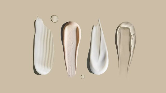 cosmetic smears cream texture on pastel background