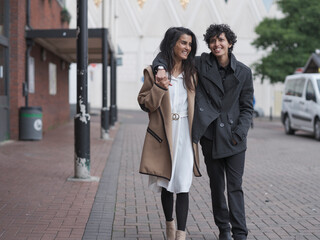 Female couple walking in street