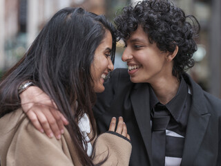 Smiling female couple embracing