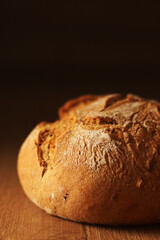 A loaf of rye bread in low key	