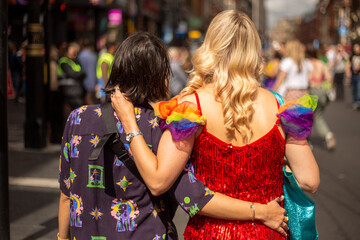Two women at�LGBT�parade, rear view