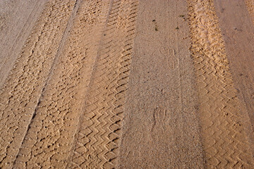 tyre tracks on muddy dirt road