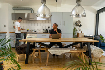 UK, London, Gay couple in kitchen
