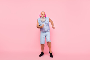 Full length photo of dreamy funky retired guy wear jeans waistcoat earphones having fun isolated...