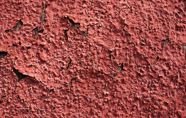 Abstract wall with dry old red crack paint