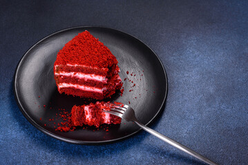 Red velvet cake, classic three layered cake from red butter sponge cakes with cream