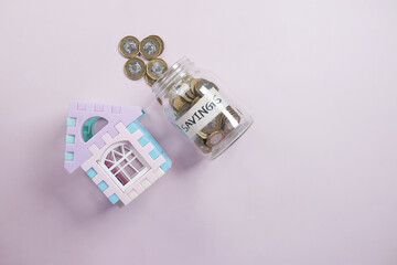  coins and house on table , the concept of house finance 