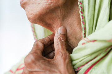 senior women suffering throat pain close up 