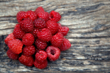 Fresh organic red raspberries. Composition with non-gmo red raspberries on the table. The concept...